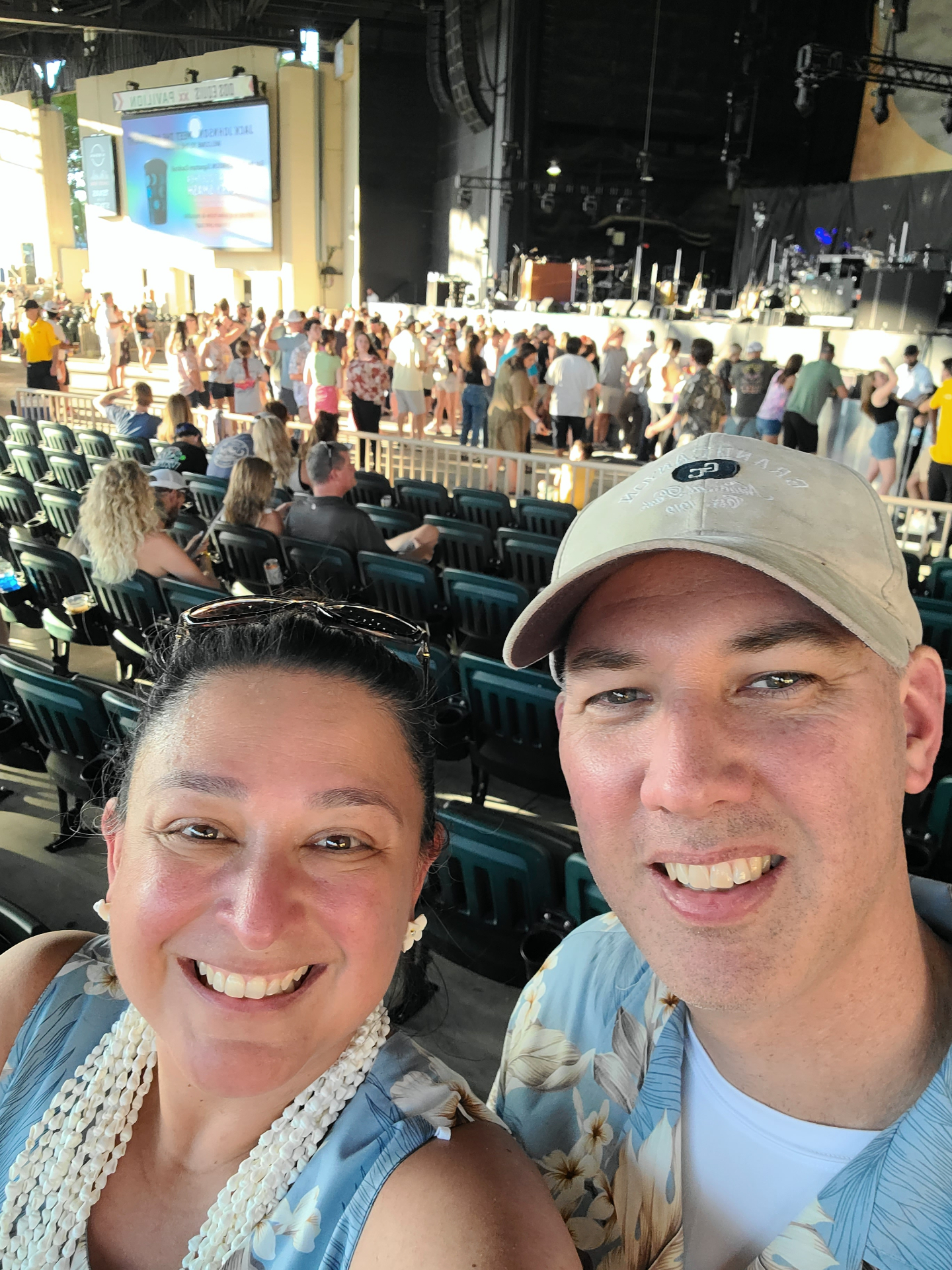 Michelle and her husband enjoying a live outdoor concert